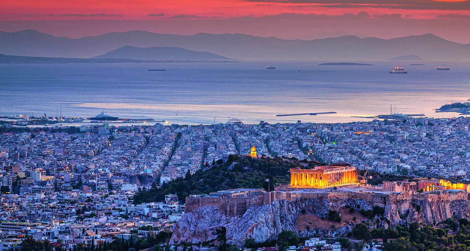 View over the greek capital city of Athens with the famous Acropolis in Sunset Twilight. Athens, Attica, Greece, Southeast Europe