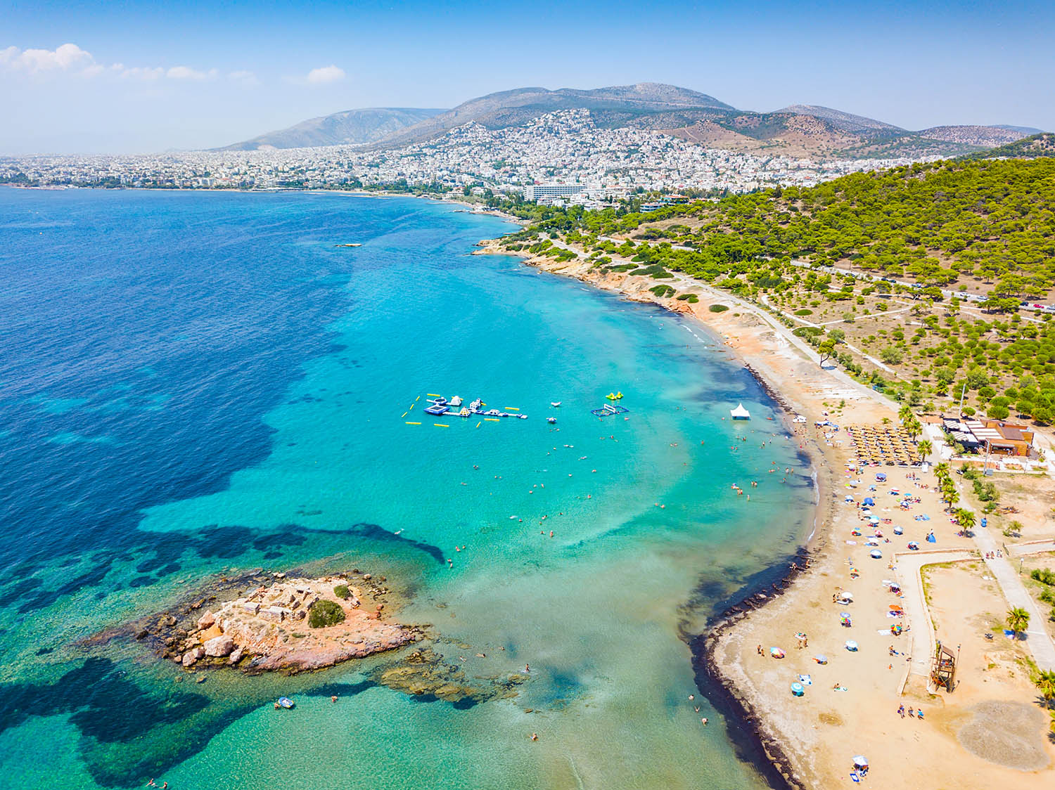 Aerial view of the Beach of Kavouri in south Athens, Greece, with turquoise waters and view to the city