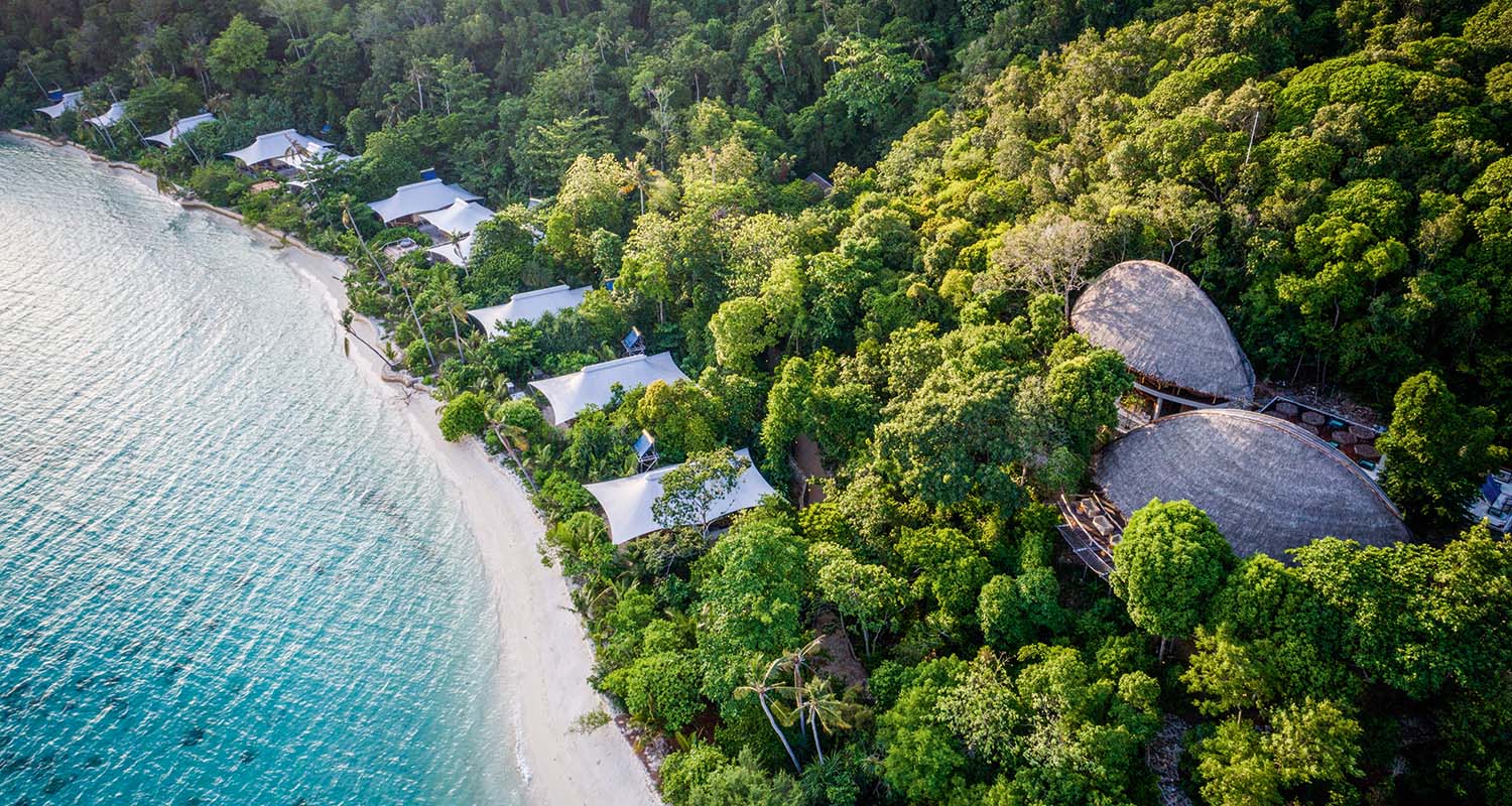 aerial_west_beach_suites_green_forest_background